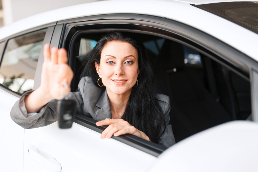 Woman Driving a White Car