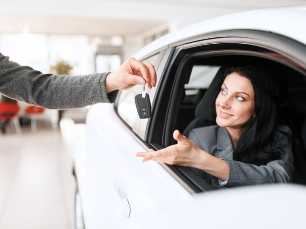 Woman Driving a White Car